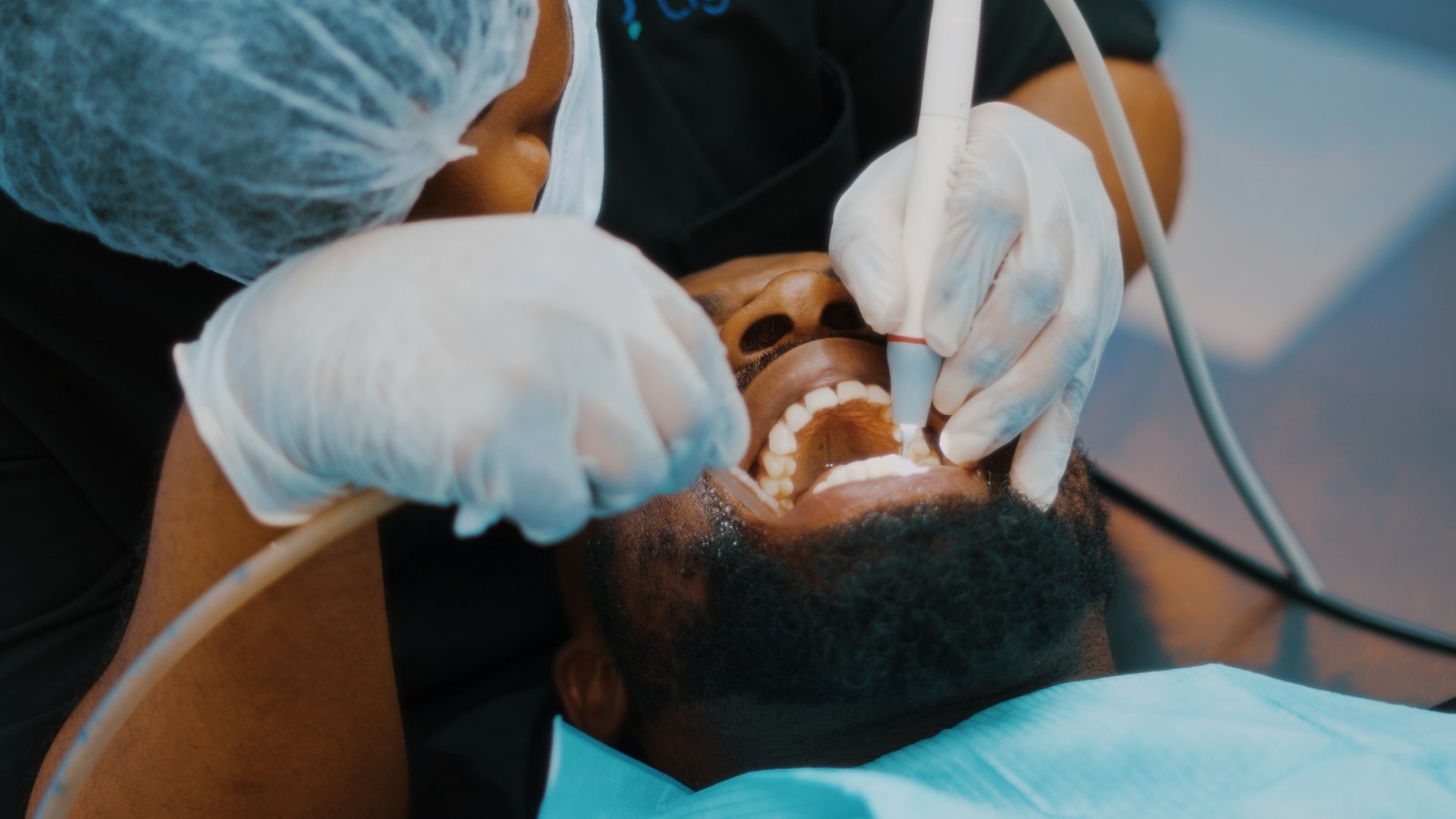 Dentist checking a patient's teeth at the clinic